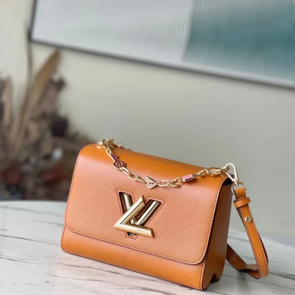 Sac à main Louis Vuitton Twist mini coloris orange 23 × 17 × 9 cm — réplique