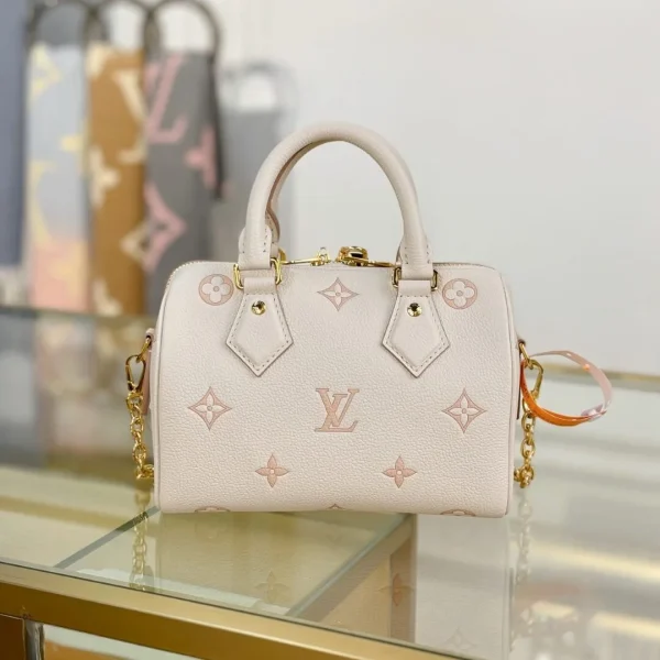 Modèle Louis Vuitton Monogram Empreinte coloris bicolore Speedy Bandoulière 20 — réplique