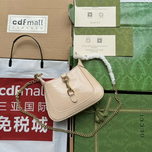 Sac JACKIE NOTTE mini 19 en coloris beige craquelé laqué — réplique
